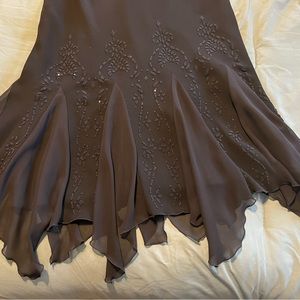 Black halter dress / beading below waste sparkles. Frilly hemline very slimming